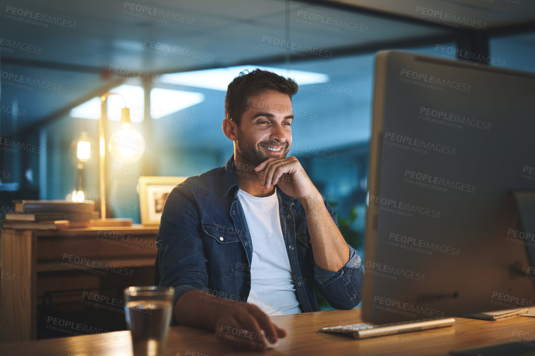 Buy stock photo Computer, night and man in office with research for software development and data analytics of system. Reading, technology and male IT specialist working overtime with online firewall configuration.