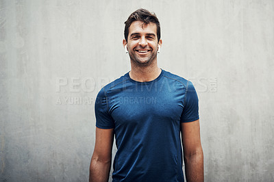 Buy stock photo Fitness, portrait and happy man listening to music outdoor for exercise, training and healthy body. Face, sport and person on earphones for radio or streaming audio on wall background space in Spain