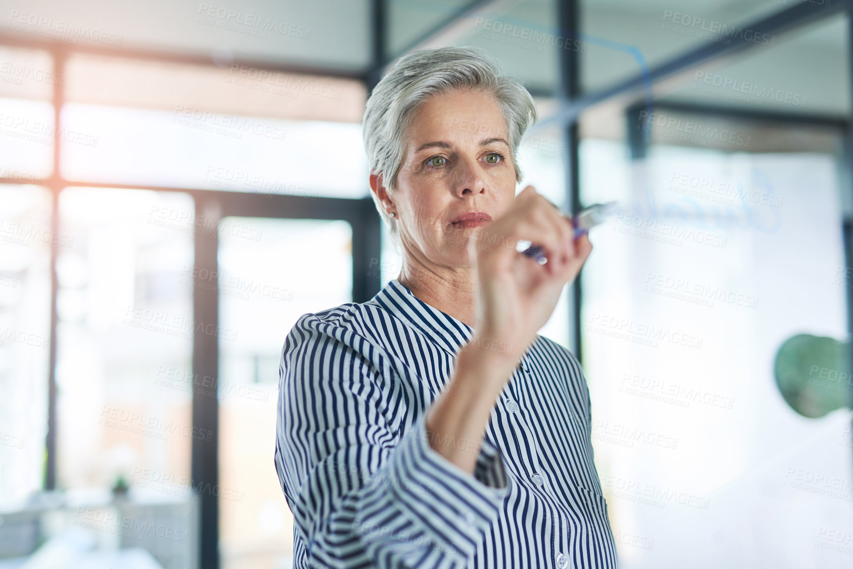 Buy stock photo Glass board, writing and business woman in office for planning corporate investment strategy. Information, notes and mature financial analyst brainstorming for stock market shares for company profit.