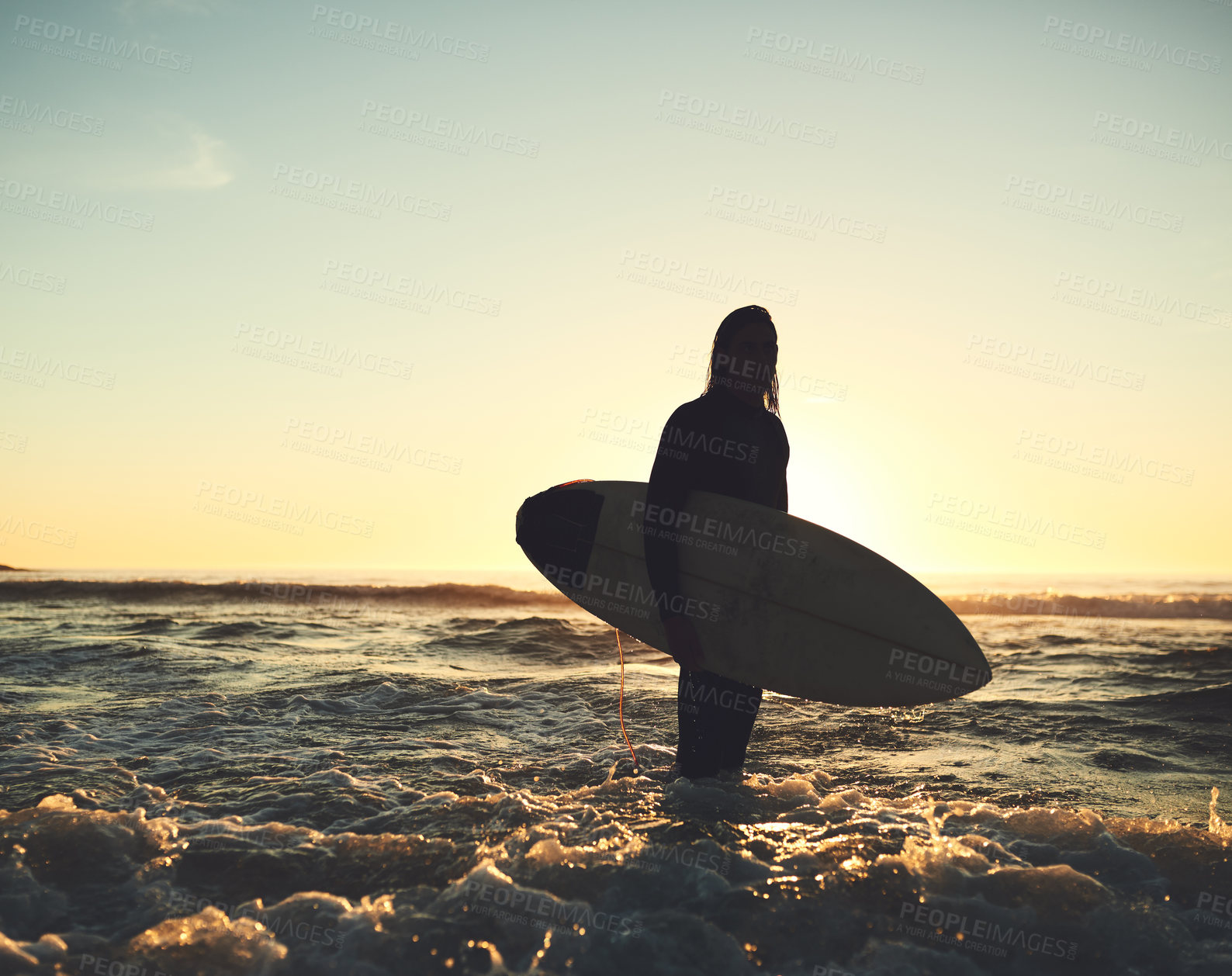 Buy stock photo Shot of a young man carrying a surfboard at the beach
