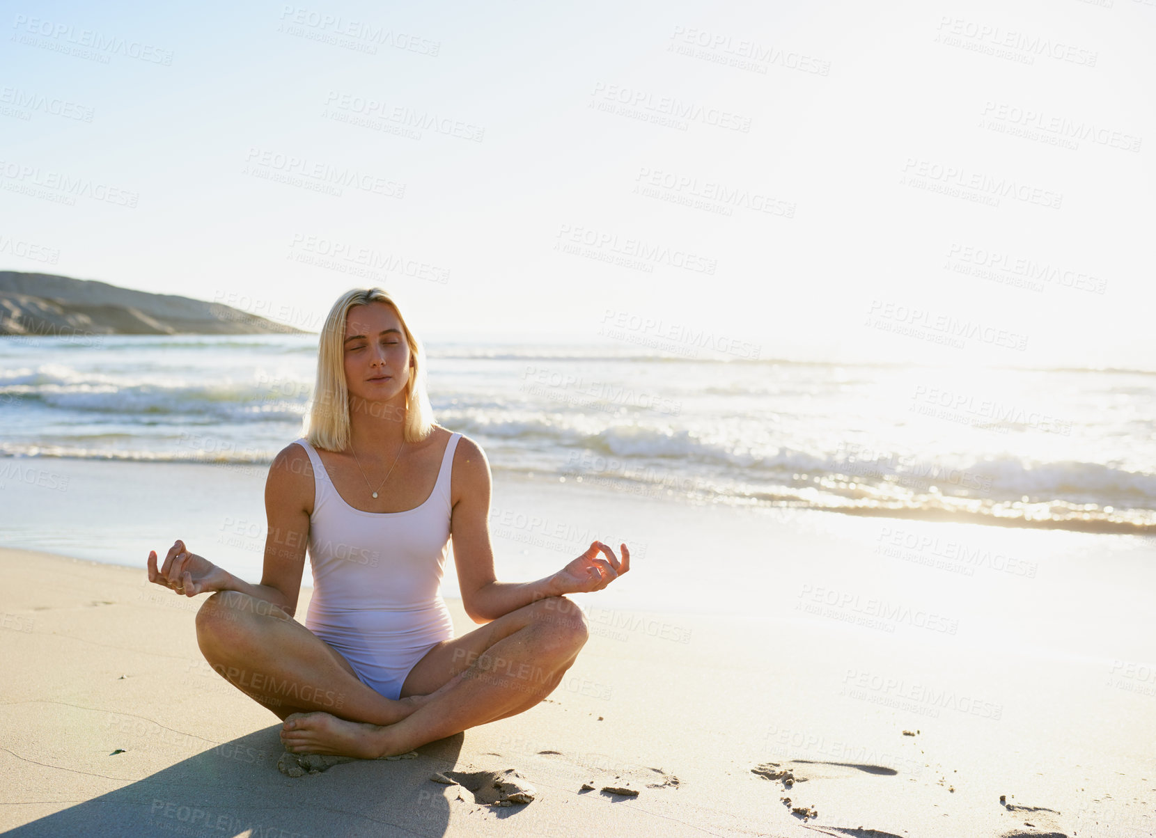 Buy stock photo Beach, waves and woman with meditation in summer for holistic healing, mindfulness and awareness. Zen, person and lostus pose with peace on sand by ocean for chakra balance, exercise or mental health