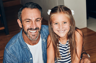 Buy stock photo Portrait of an adorable little girl spending quality time with her father at home