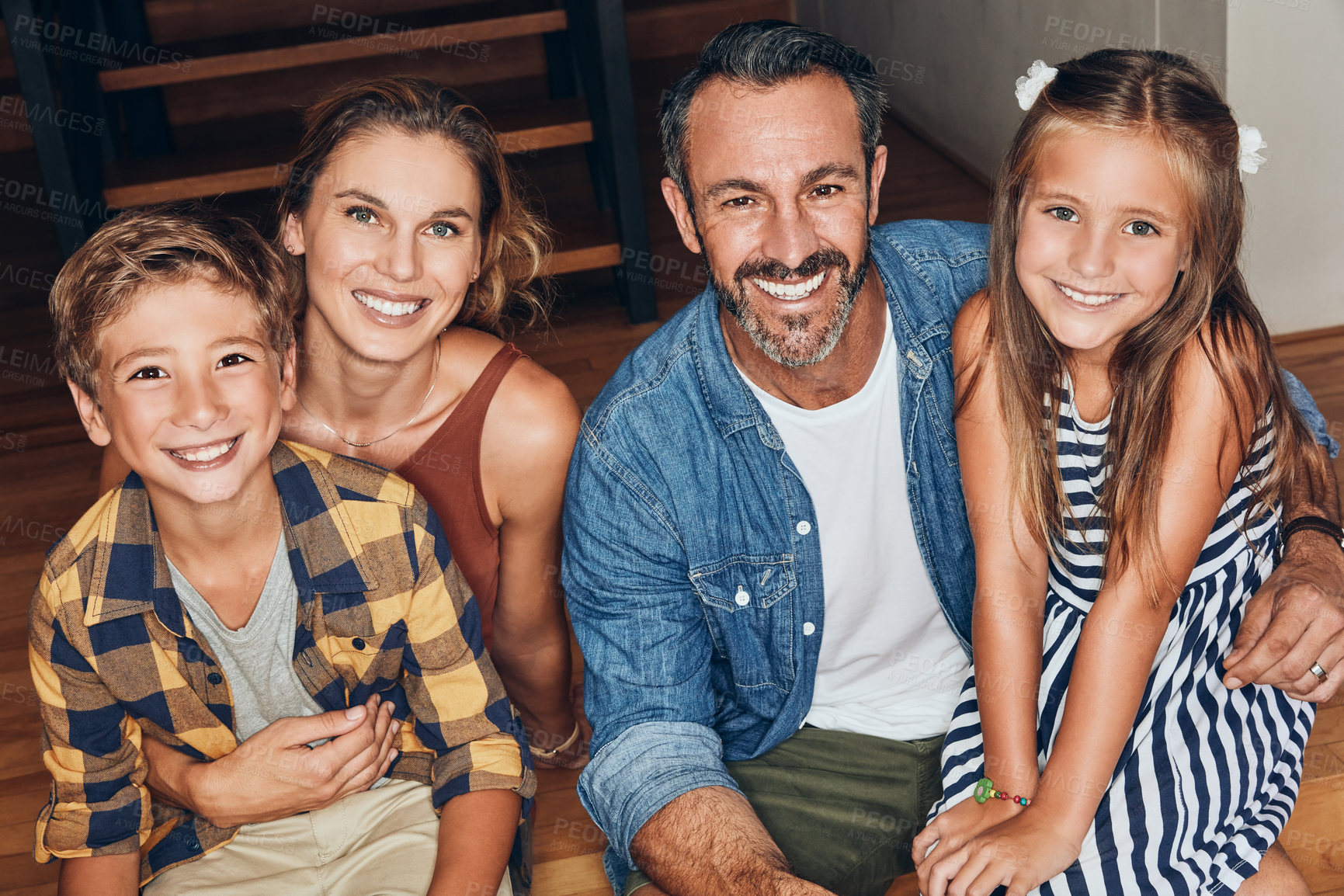 Buy stock photo Portrait of a happy young family spending quality time at home