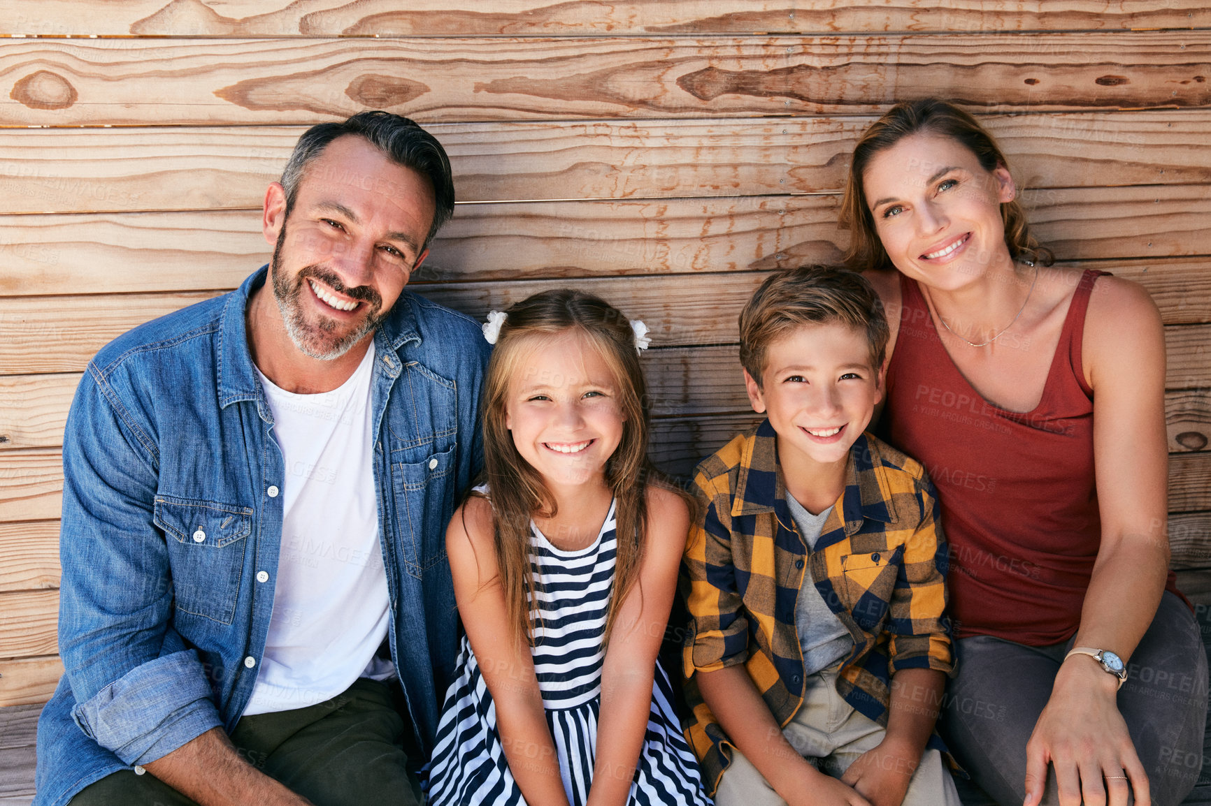 Buy stock photo Portrait of a happy young family spending quality time at home