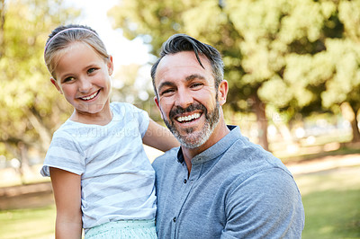 Buy stock photo Shot of an adorable little girl spending quality time with her father in the park