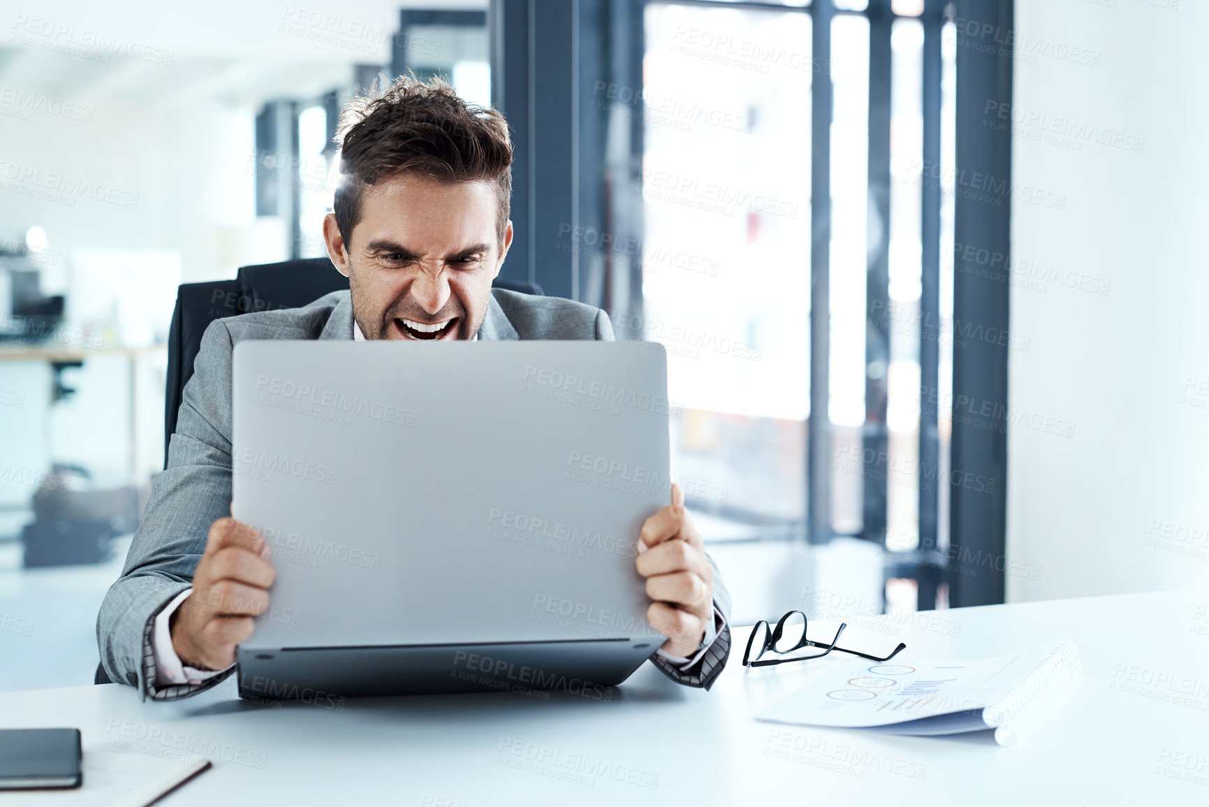Buy stock photo Angry, man and stress with laptop in office frustrated with glitch, mistake or crisis. Anxiety, annoyed and male business person upset with fail, 404 and bad review, deadline report or tech problem