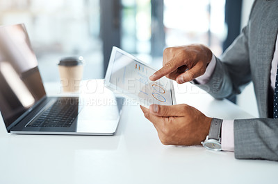 Buy stock photo Cropped shot of an unrecognizable businessman using a digital tablet