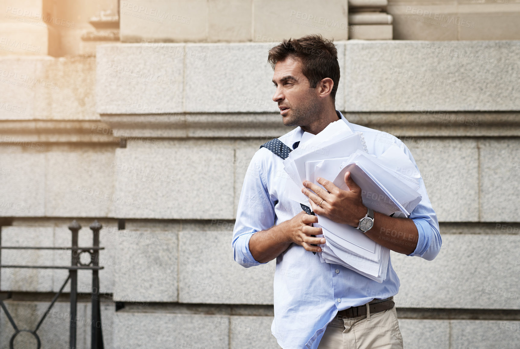 Buy stock photo Business, outdoor and man with stress, documents and burnout with workflow crisis, deadline and legal aid. Person, New York or employee with paperwork, thinking and overtime with chaos or frustrated
