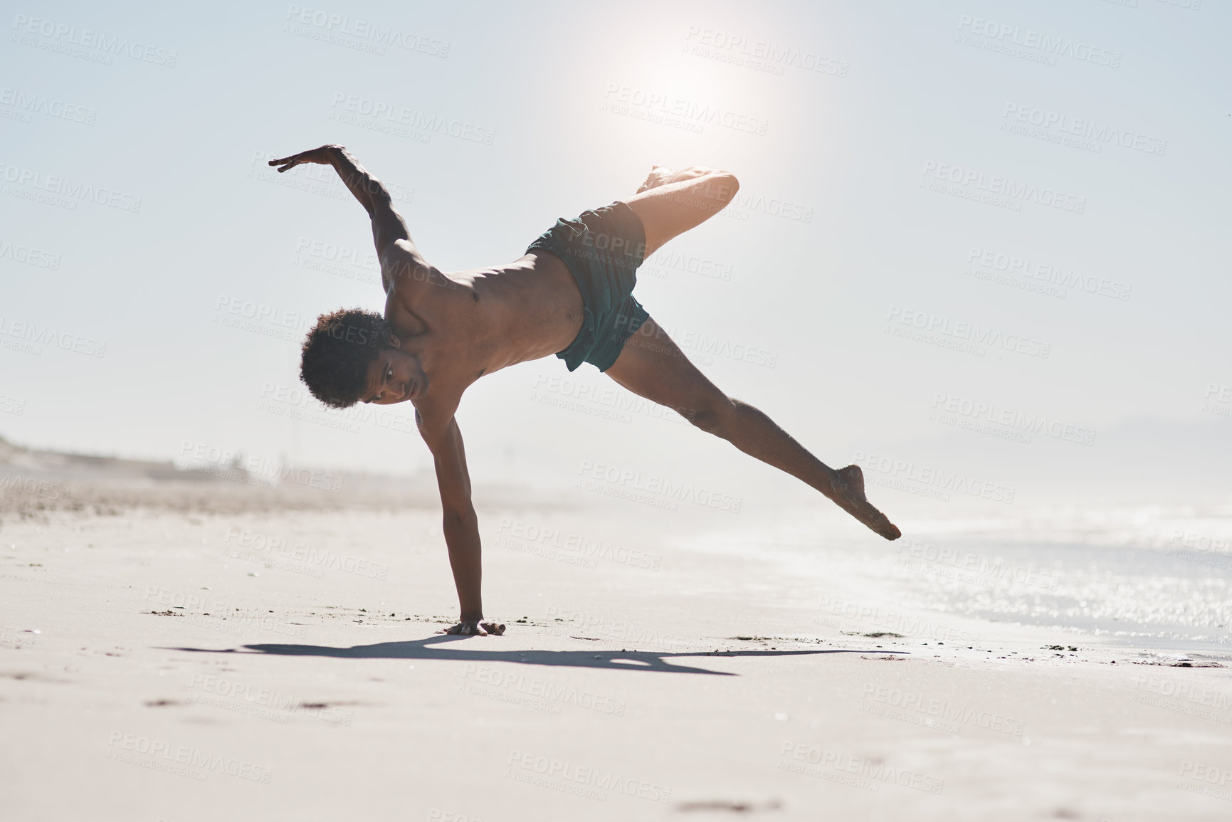 Buy stock photo Beach, balance and man dancing by ocean on summer vacation, holiday or travel. Sea, exercise and person moving with energy for performance art, training or capoeira in nature outdoor with handstand