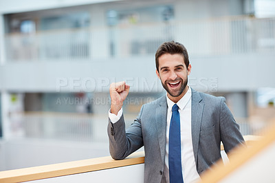 Buy stock photo Portrait of a young businessman cheering in an office
