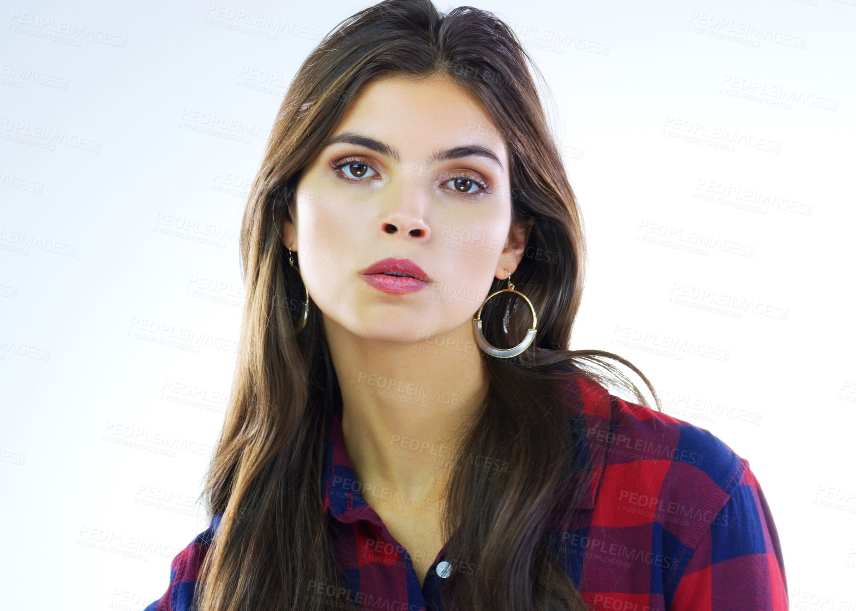 Buy stock photo Cropped shot of a young woman posing against a white background