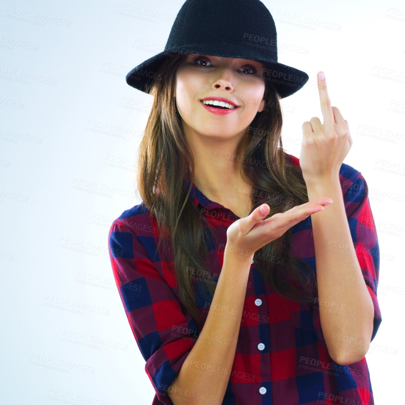 Buy stock photo Cropped shot of a young woman showing middle finger against a white background