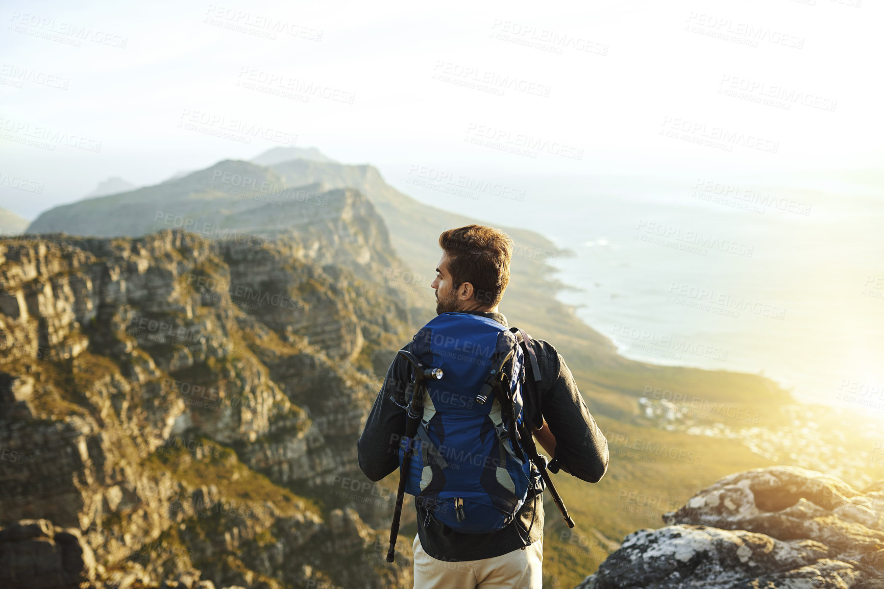 Buy stock photo Man, mountain and backpacking for outdoor exercise, travel and hiking in nature for tourism journey. Male person, trekking and athlete for sky mockup space, adventure and back for holiday workout