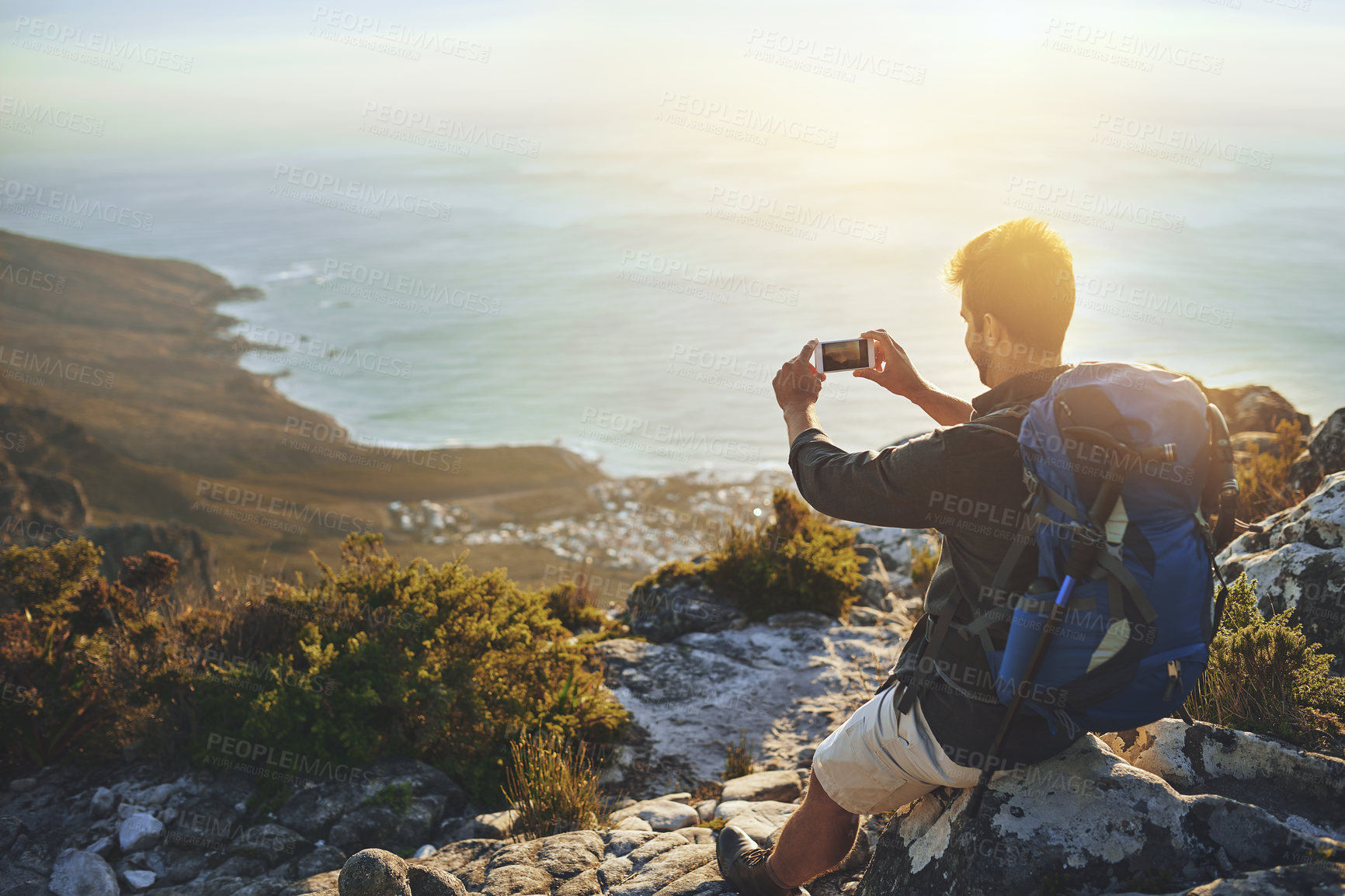 Buy stock photo Selfie, sea and man with backpack, hiking and view with adventure, vacation and coastline. Outdoor, hiker and healthy person with smartphone, picture and ocean with internet, mountains and journey