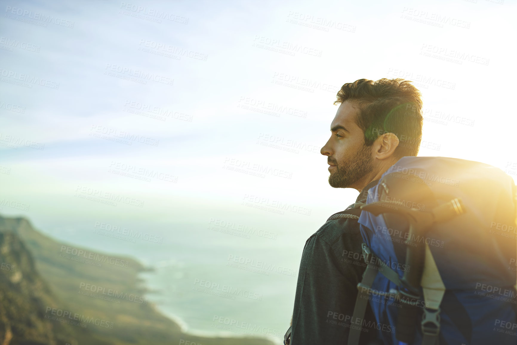 Buy stock photo Man, mountain and backpacking for outdoor thinking, travel and hiking in nature for tourism journey. Male person, profile and athlete for sky mockup space, wondering and exercise for holiday workout