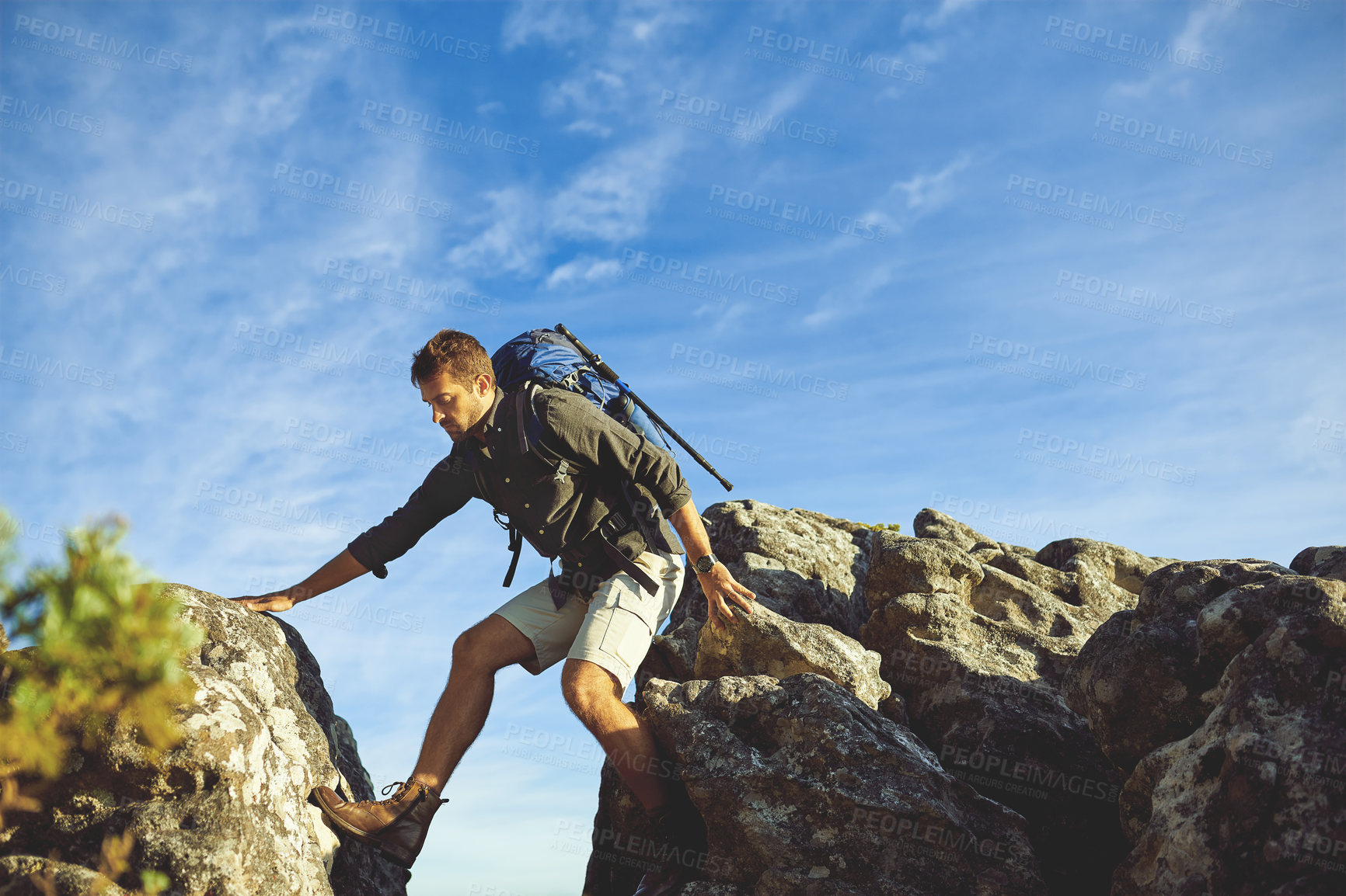 Buy stock photo Man, mountain and climbing with backpack outdoor of fitness adventure, sports challenge and hiking travel. Male person, rocks and trekking balance with cliff exercise, performance and nature explore