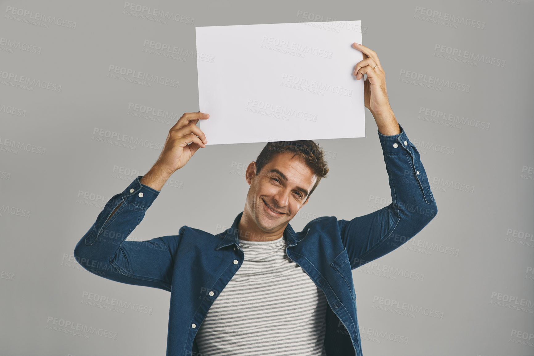 Buy stock photo Portrait, opportunity and man with poster, blank or promotion with happy guy on gray studio background. Face, person or model with billboard, announcement or design with sales, option or mockup space