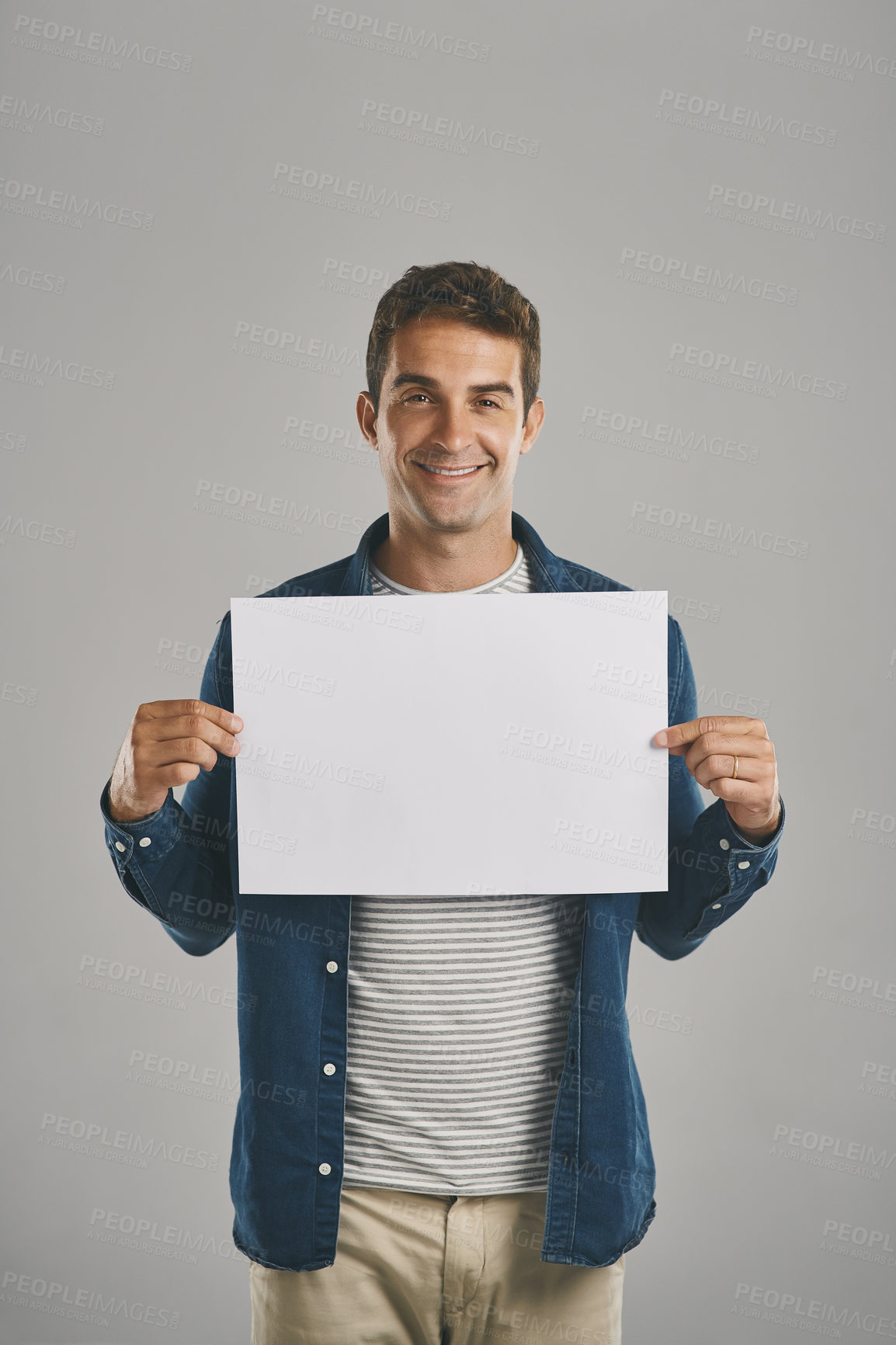 Buy stock photo Portrait, showing and man with poster, blank and promotion with guy on gray studio background. Face, person and model with billboard, opportunity and design with presentation, sales or mockup space