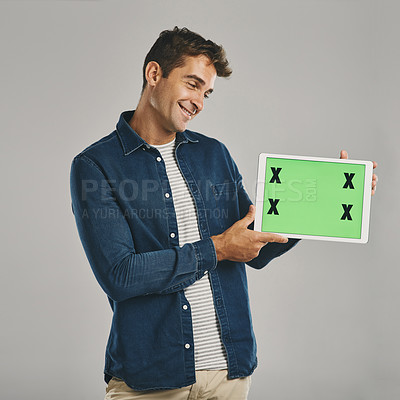 Buy stock photo Internet, green screen and man with tablet, smile and person on gray studio background. Communication, opportunity or model with tech, tracking markers and promotion with website info or connection