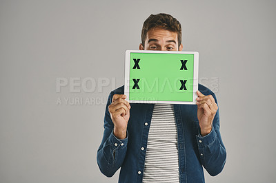 Buy stock photo Happy, green screen and man with tablet, showing and person on gray studio background. Connection, guy or model with tech, tracking markers or website info with internet, digital app or communication