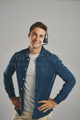 Buy stock photo Call center, man and studio with happiness on headset for customer service or advice on white background. Male person, portrait and smile or proud with headphones for telemarketing and consulting