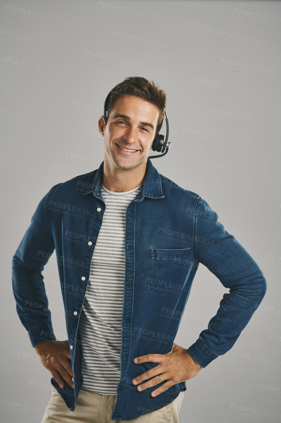 Buy stock photo Call center, man and studio with happiness on headset for customer service or advice on white background. Male person, portrait and smile or proud with headphones for telemarketing and consulting