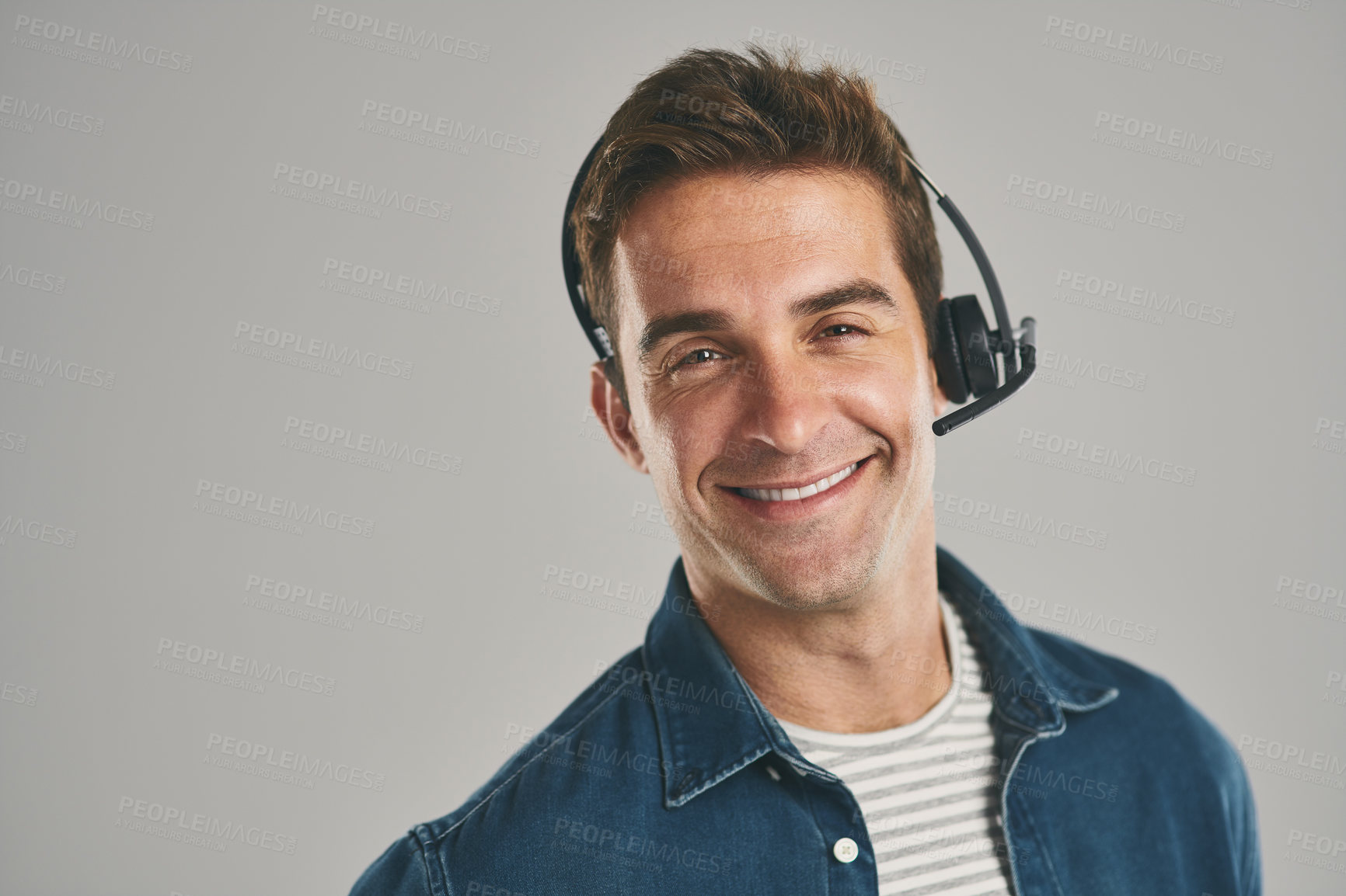 Buy stock photo Call center, man and studio with smile on headset for customer service or advice on white background. Male person, portrait and happy or proud with headphones for telemarketing and consulting