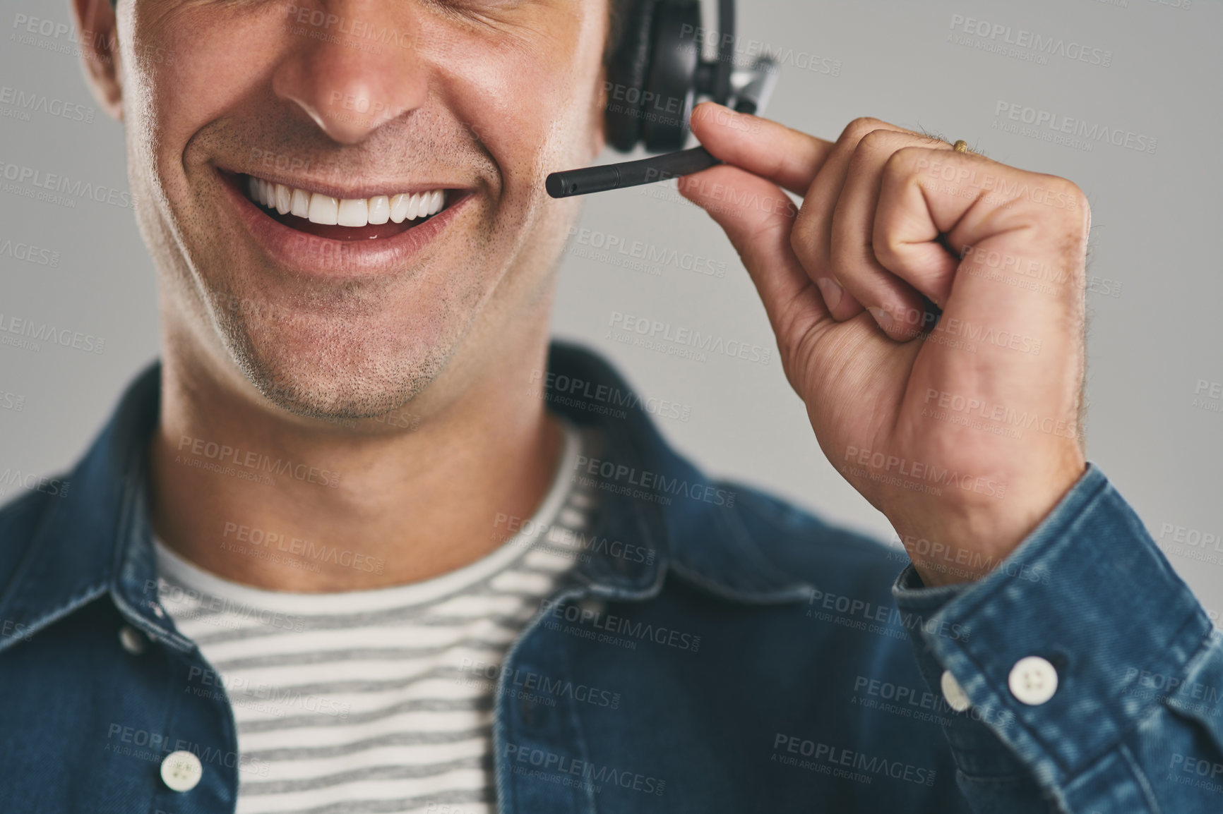 Buy stock photo Call center, man and mouth in studio with smile on headset for customer service or advice on white background. Male person, smile and happy or proud with headphones for telemarketing and consulting