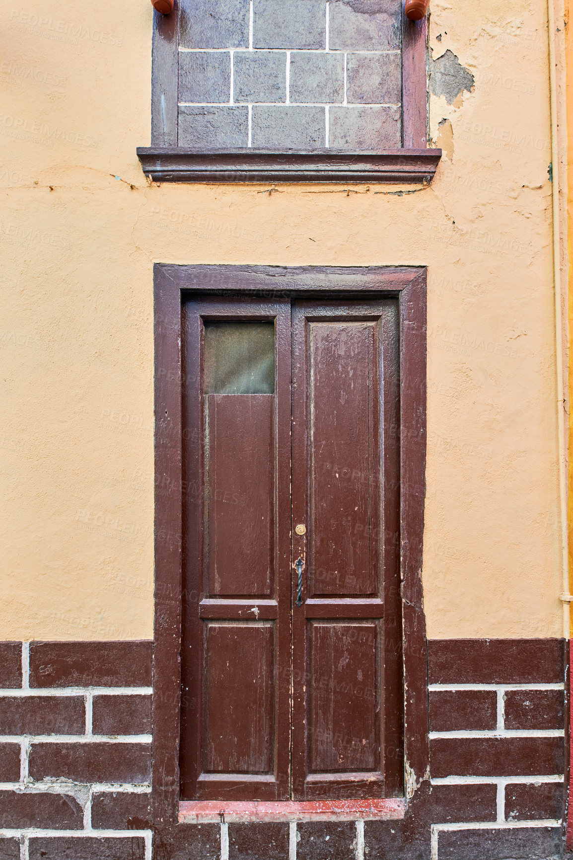 Buy stock photo Old house or church with peeling paint on wall or window and wooden shutter door. Vintage and aged residential building built in a traditional architectural style or design in Santa Cruz de La Palma