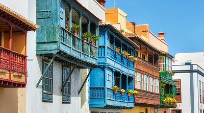 Buy stock photo Old buildings in a city built by traditional architecture in a small town or village. Home or flats with a vintage design close to each other outdoors with a blue sky in Santa Cruz de La Palma 