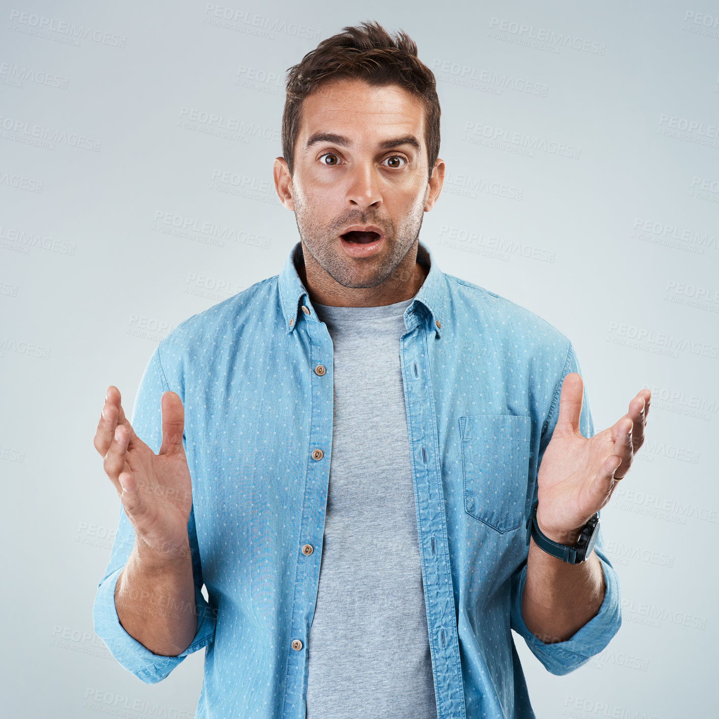 Buy stock photo Portrait of a surprised facial expression standing against a grey background