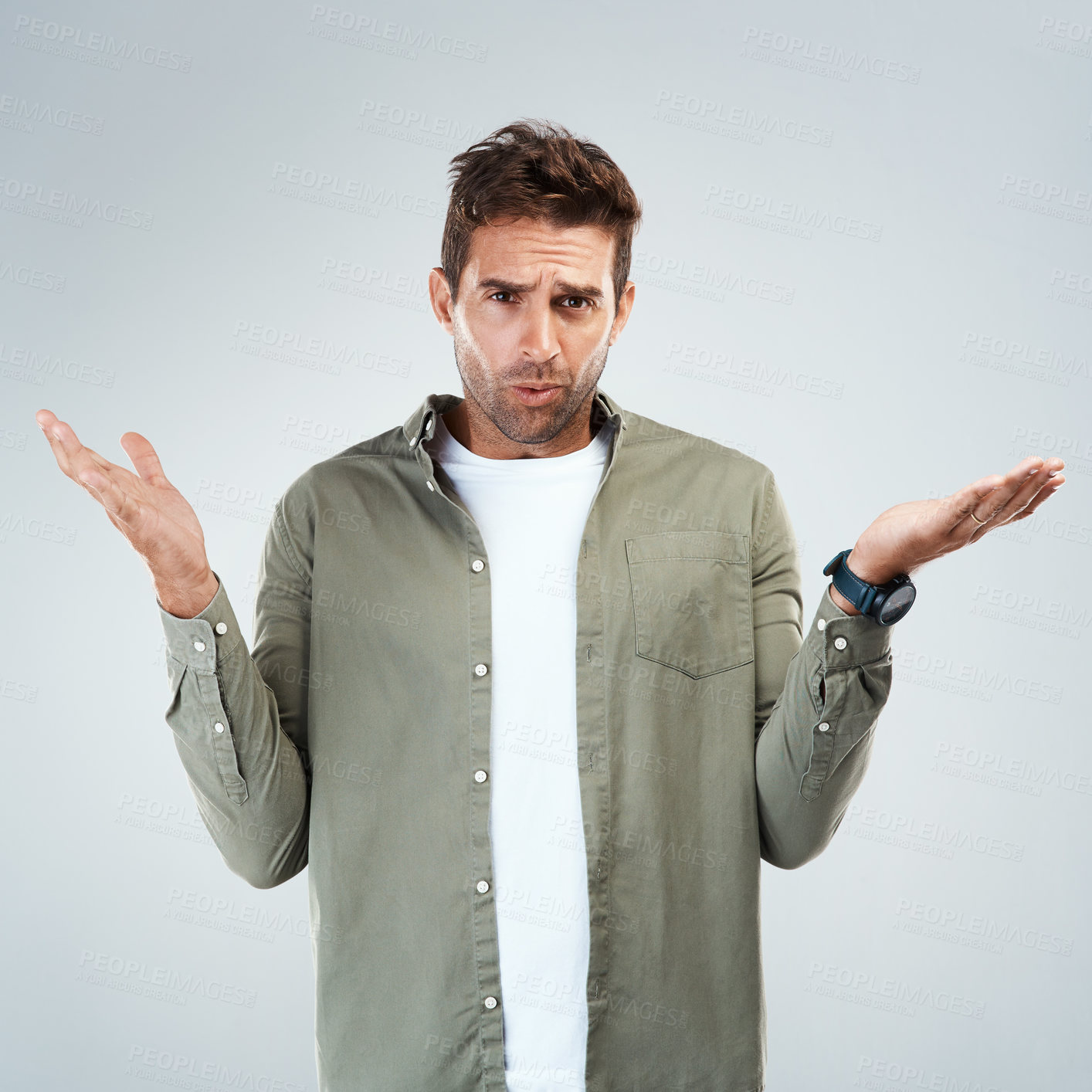 Buy stock photo Man, portrait and confused by choice, option or decision in gray background with hand gesture in studio. Male person, doubt and thinking as frustrated consumer or target audience for product or sale
