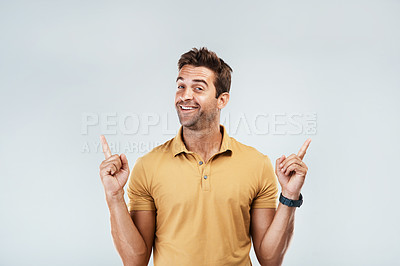 Buy stock photo Excited, mockup and man pointing in studio isolated on a gray background. Smile, hand gesture and happy person advertising, marketing offer and approve of commercial copy space for promotion or deal