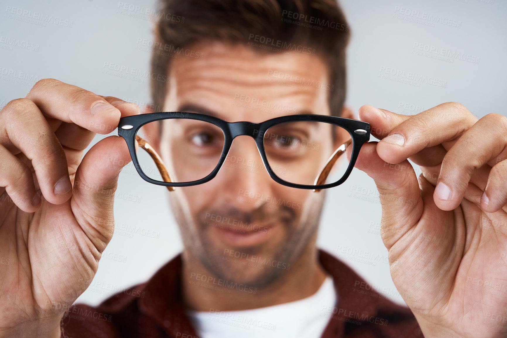 Buy stock photo Glasses, hands and man in portrait for eye care, vision and clean lenses on white background. Male person, new frames and optometry in studio with spectacles, eyewear brand and smile for prescription