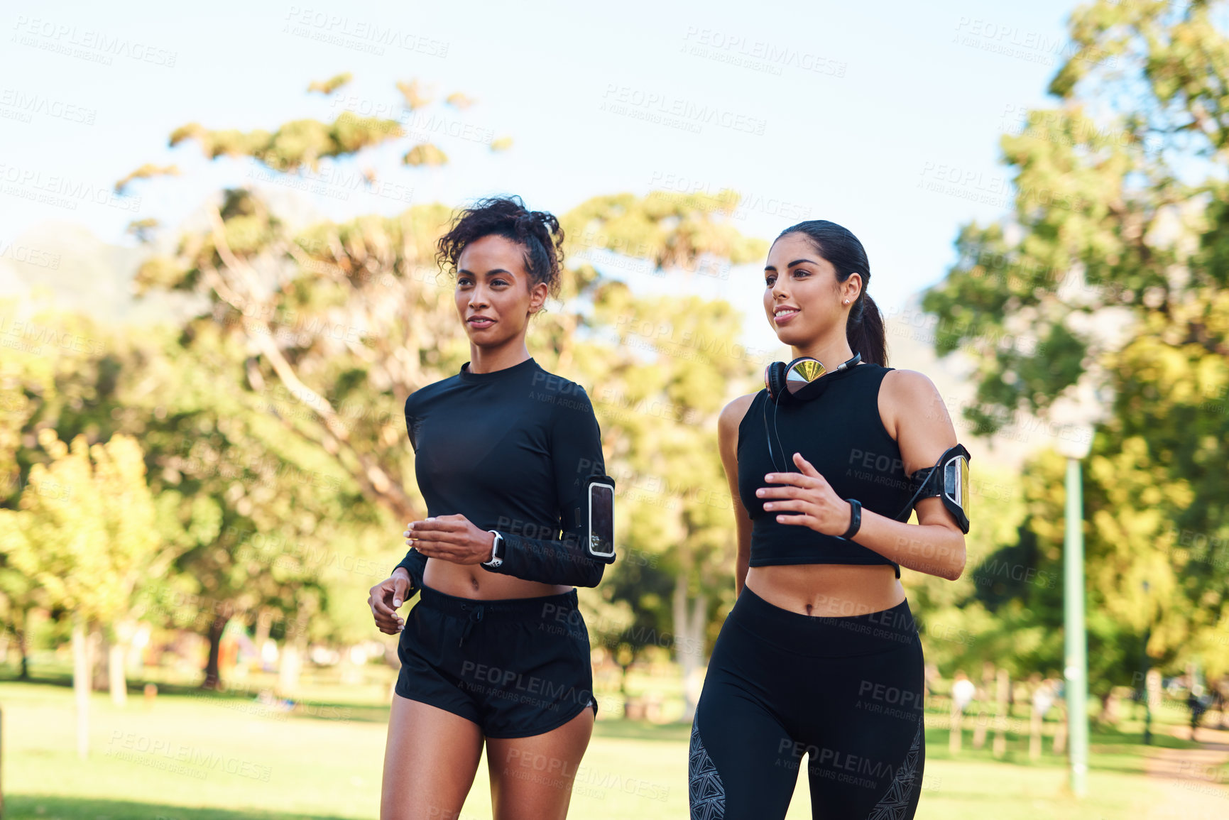 Buy stock photo Friends, girls and fitness with jog in park in happiness for workout and running in Atlanta. People, runner and smile or confident with exercise for health, wellness and self care on race in forest