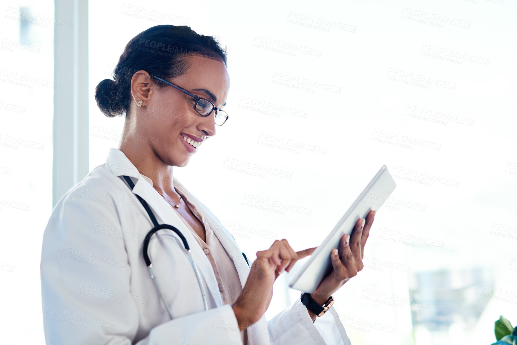 Buy stock photo Doctor, hospital and happy woman on tablet for research, information and healthcare update. Technology, medical professional and check schedule, report or reading results on internet with good news