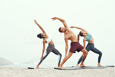 Buy stock photo Men, woman and yoga on beach with stretching balance or mindfulness with chakra, wellness or friends. People, arms and morning mist at ocean or pilates warm up for calm self care, exercise or group