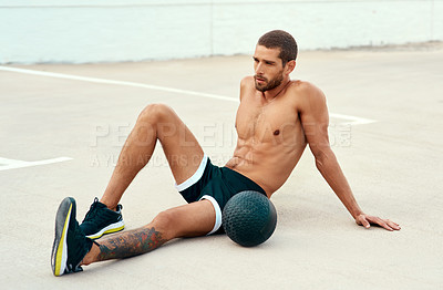 Buy stock photo Male athlete, rest and body with medicine ball for sports, exercise and fitness on break. Healthy, man and topless in workout, cardio and wellness for muscle, strong and training for mental wellbeing
