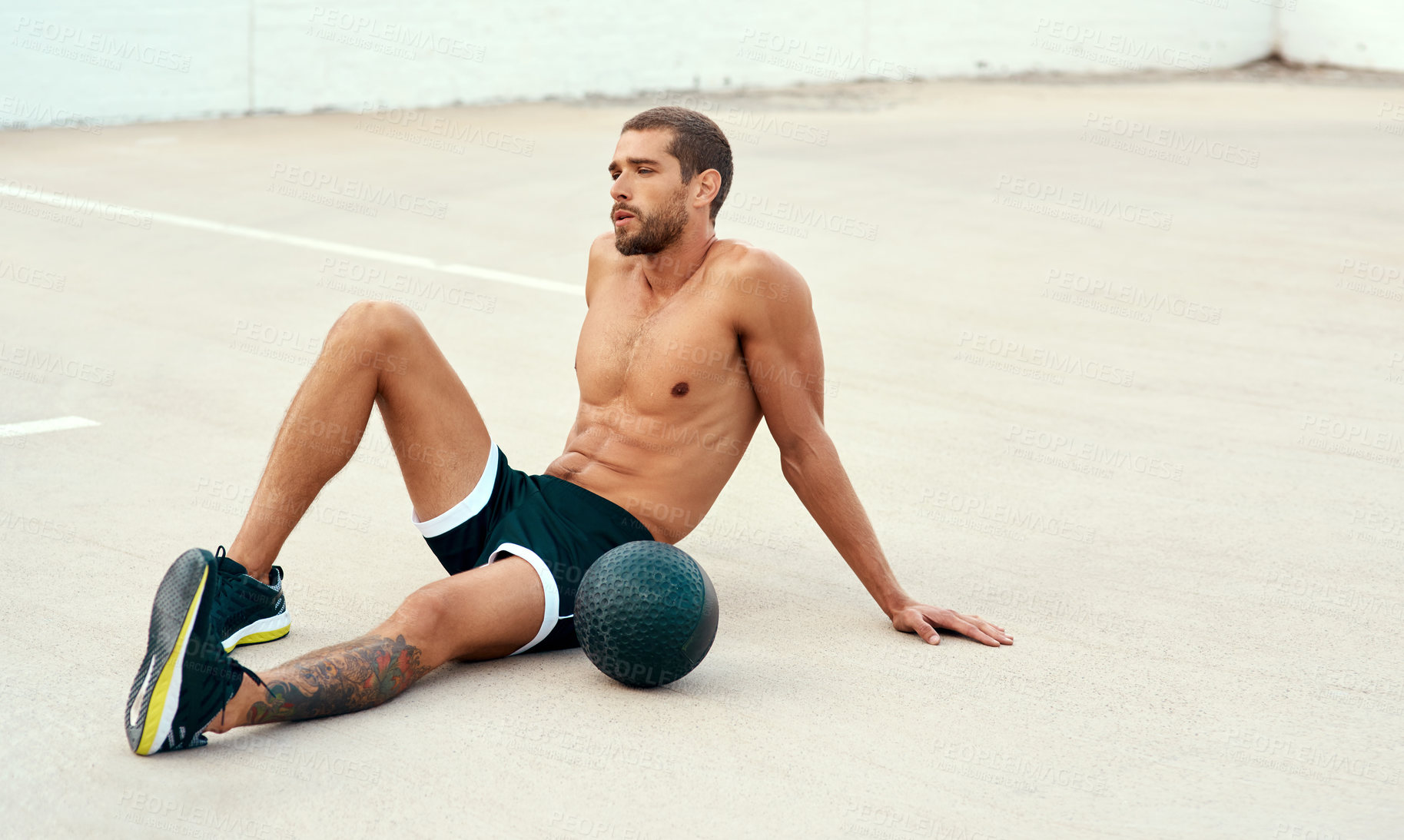 Buy stock photo Fitness, man and medicine ball in rest for sports, exercise and health in outdoor with resting or break. Male athlete, training and workout for cardio, wellness and muscles for strong, body and tired