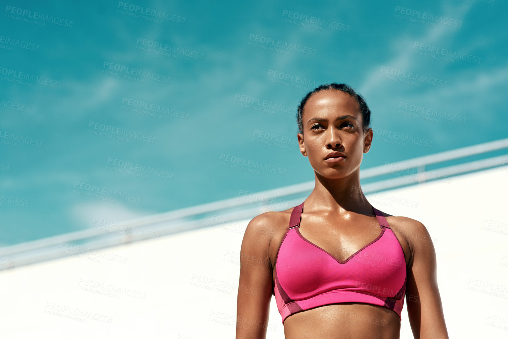 Buy stock photo Exercise, fitness and serious woman with blue sky mock up at outdoor gym for health and wellness with focus on goals. Workout, sports model and athlete with sweat, healthy mindset and fit summer goal