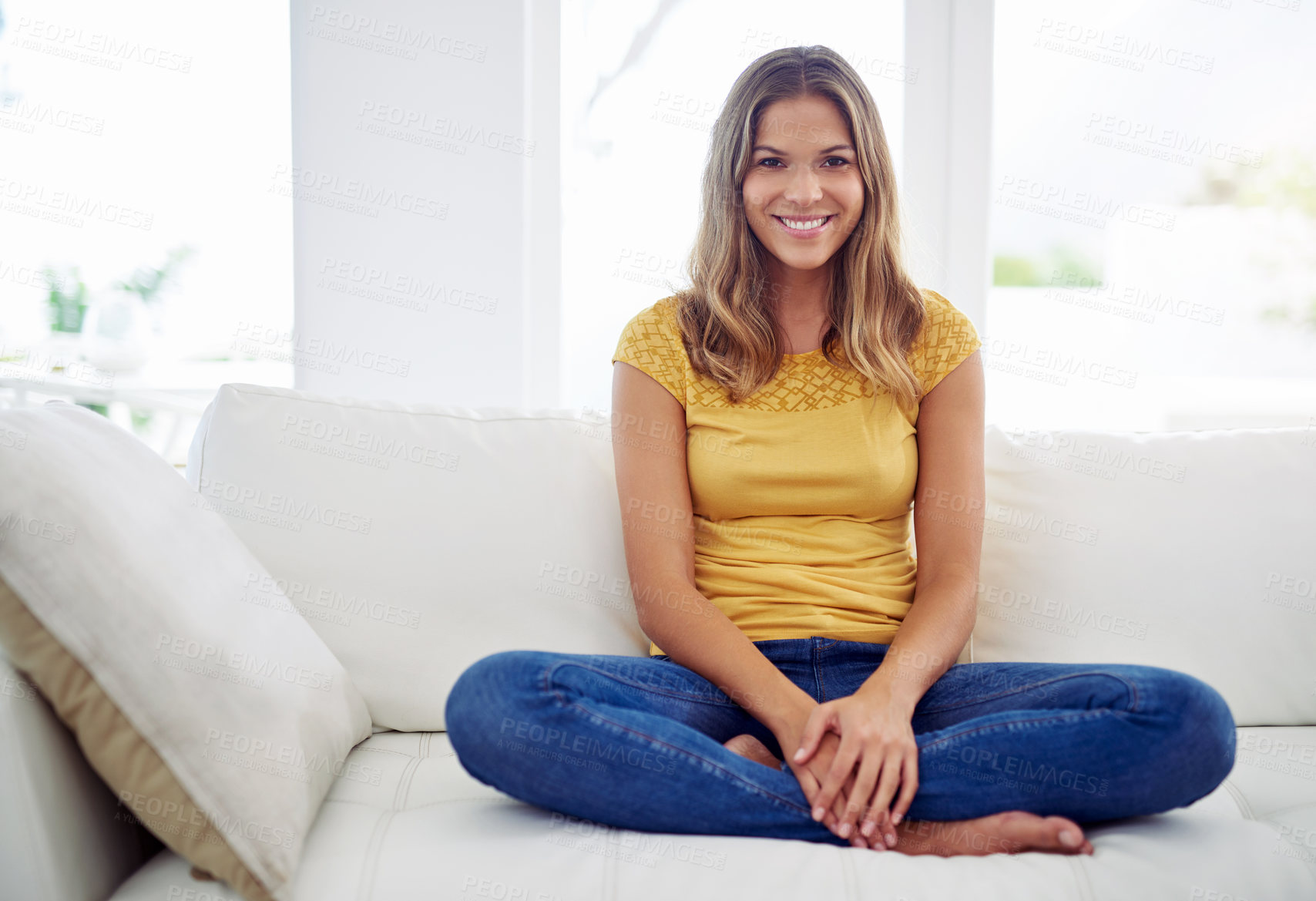 Buy stock photo Woman, portrait and smile on sofa for relax, comfort and weekend chill at home space. Girl, happy and peace on living room couch for wellness, stress free morning and optimism in Colombia apartment