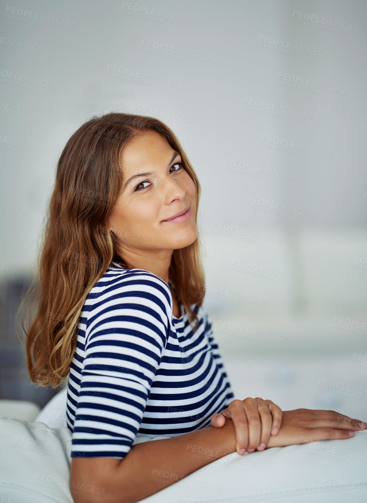 Buy stock photo Confident, portrait and woman in home to relax in house for comfort in living room for satisfaction. Smile, calm peace and casual female person in apartment on resting break for wellness in Spain