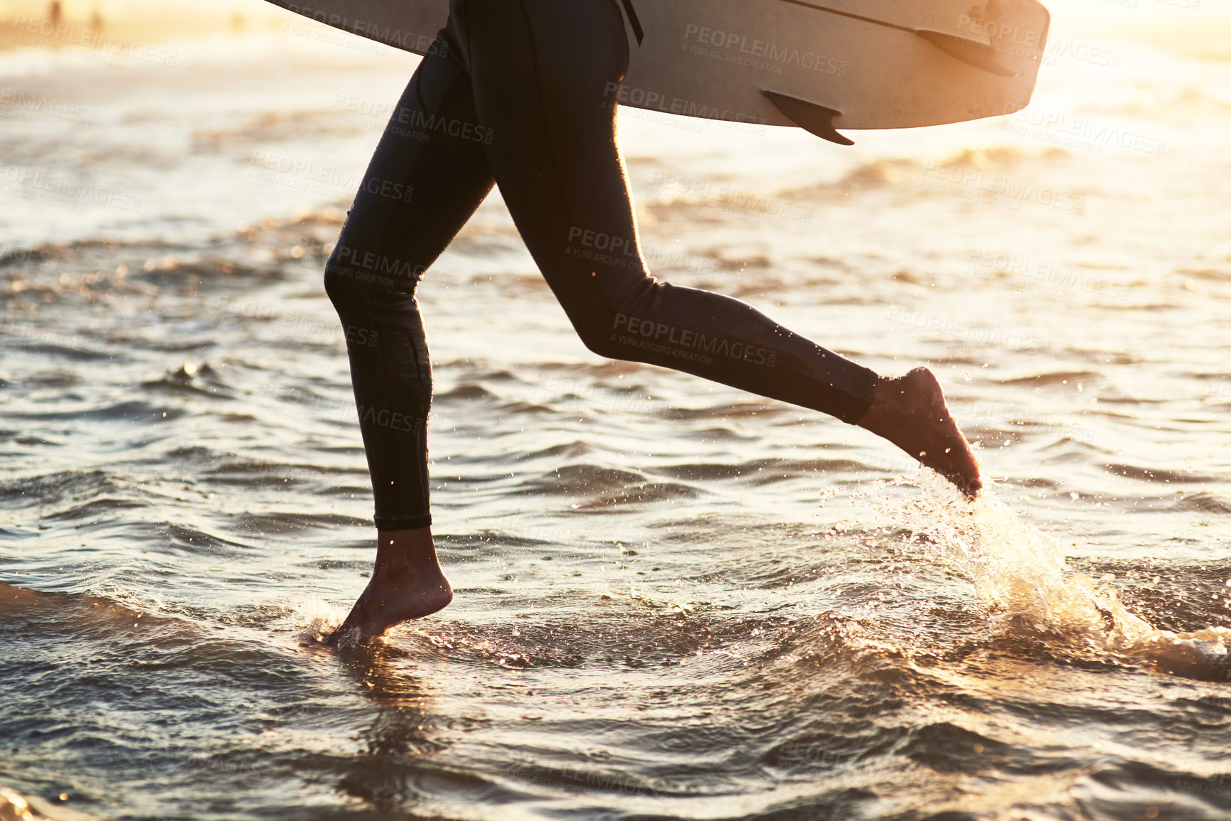 Buy stock photo Legs, running and surfboard in ocean for workout, exercise and wellness in summertime. Waves, athlete or person and cardio or water sports at beach for adventure, fitness and sunshine in California