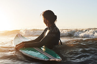 Buy stock photo Sunshine, ocean and woman surfing, fitness and exercise for wellness, balance and healthy lifestyle. Female person, surfer and girl with a surfboard, water sports and seaside for practice or sunlight