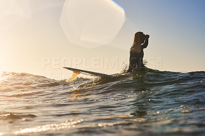 Buy stock photo Shot of a handsome young man surfing at the beach