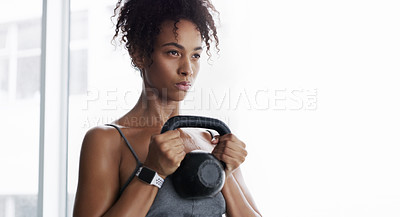 Buy stock photo African woman, kettlebell and exercise at gym with strength in workout, wellness and muscle development. Person, bodybuilder and weightlifting for change, training or transformation by mockup space