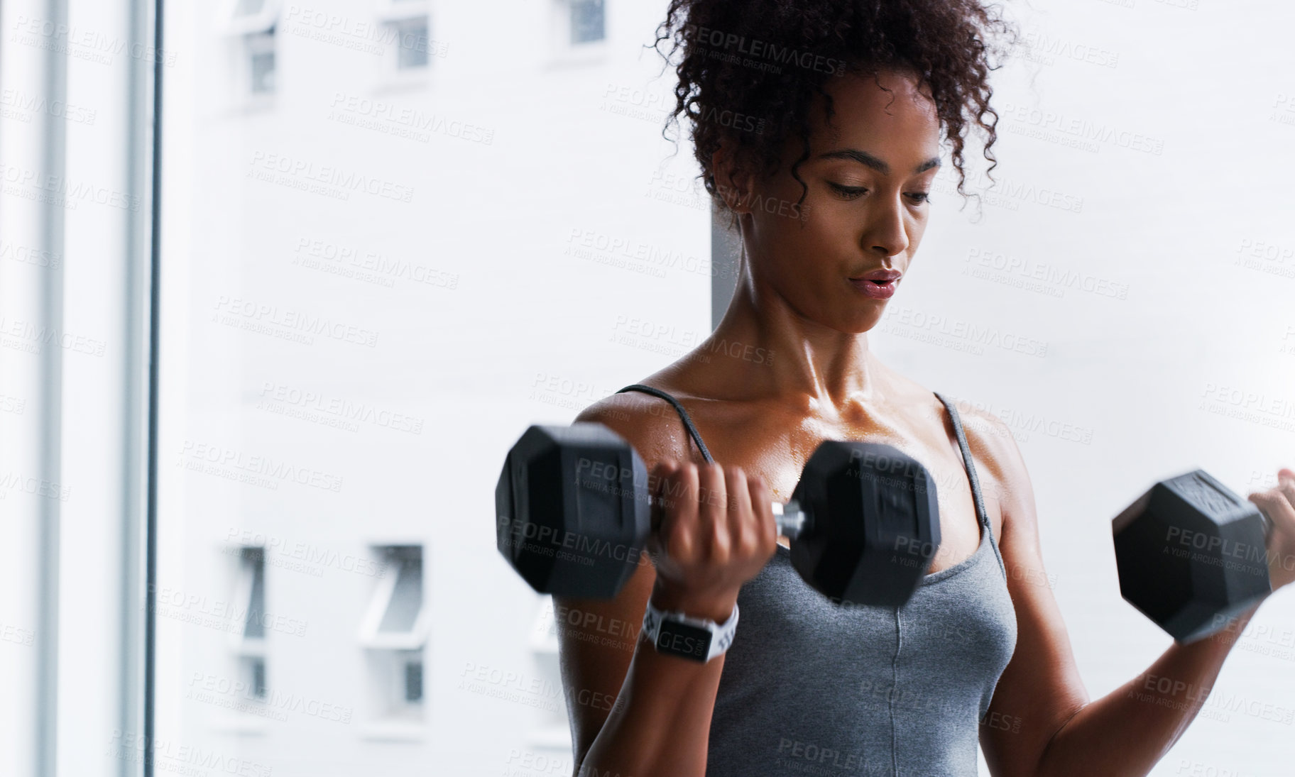 Buy stock photo African woman, dumbbells and fitness at gym with training for workout, wellness and muscle development. Person, bodybuilder and weightlifting for change, exercise or body transformation with health