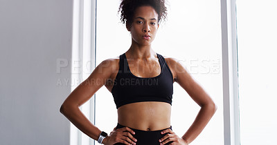 Buy stock photo Shot of a confident young woman working out in a gym