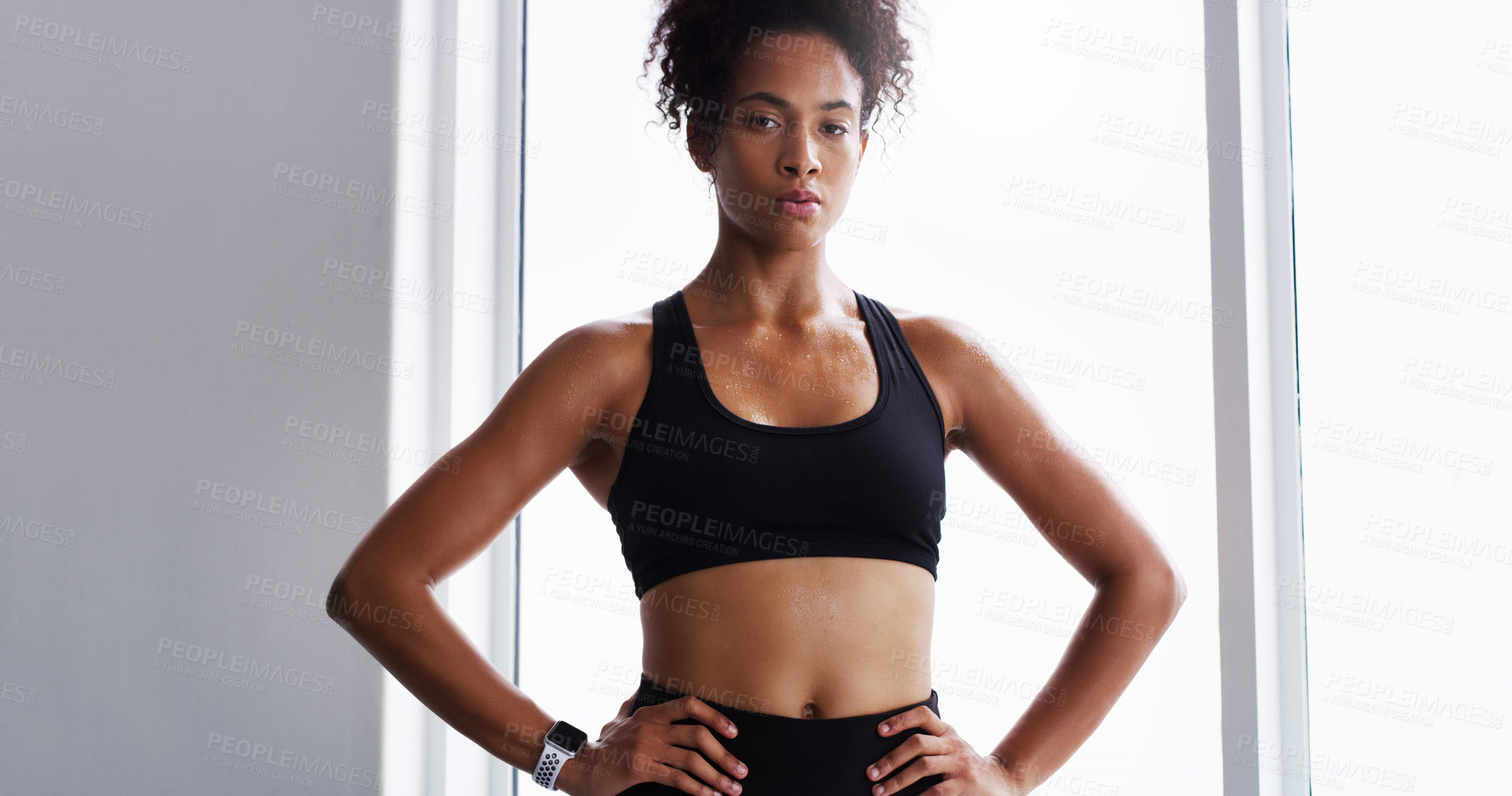 Buy stock photo Shot of a confident young woman working out in a gym