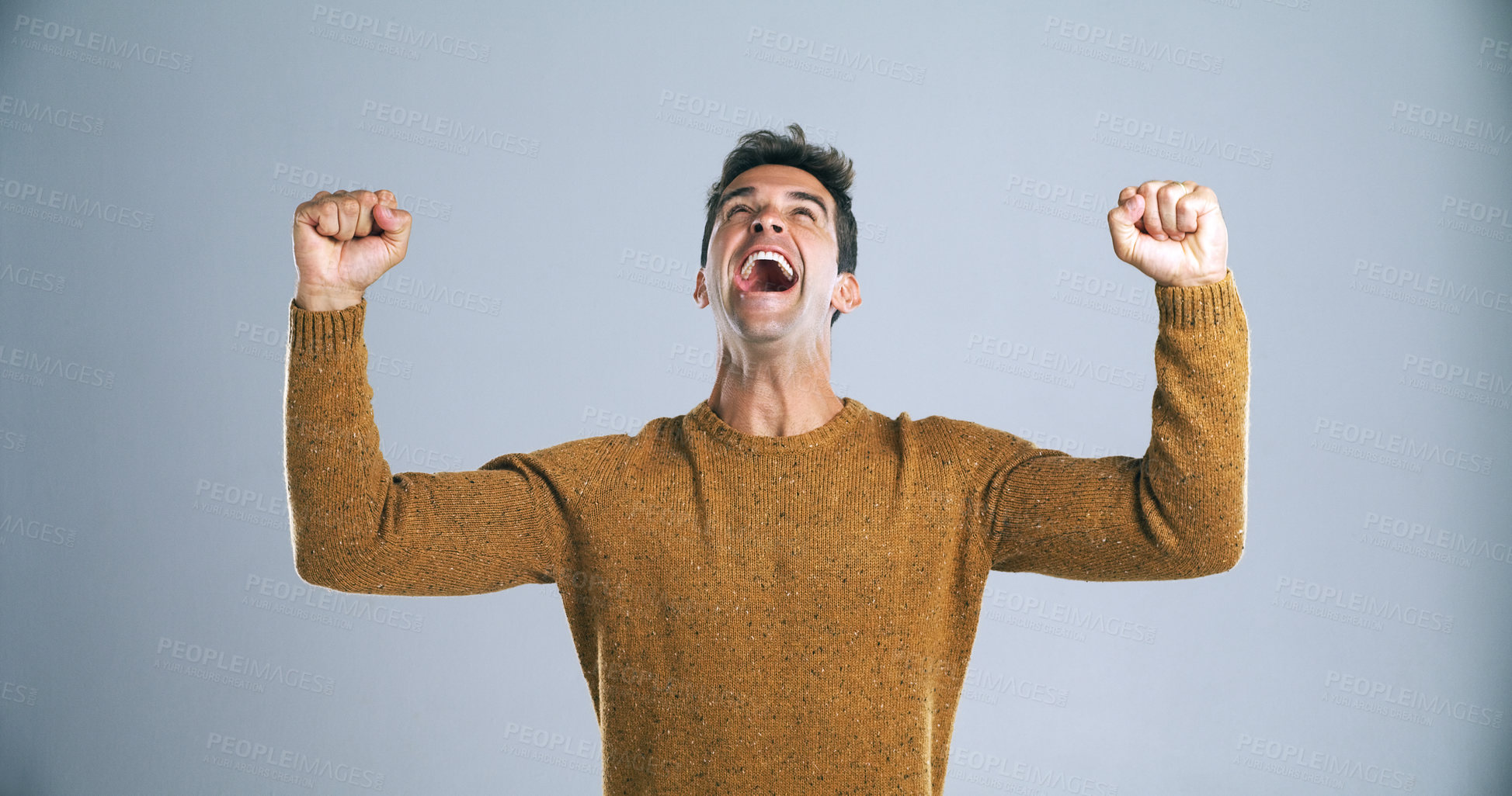 Buy stock photo Man, fist and excited for winning in studio with shout, success and goals for bonus by background. Person, happy and celebration for profit, prize and giveaway with lottery, contest or competition